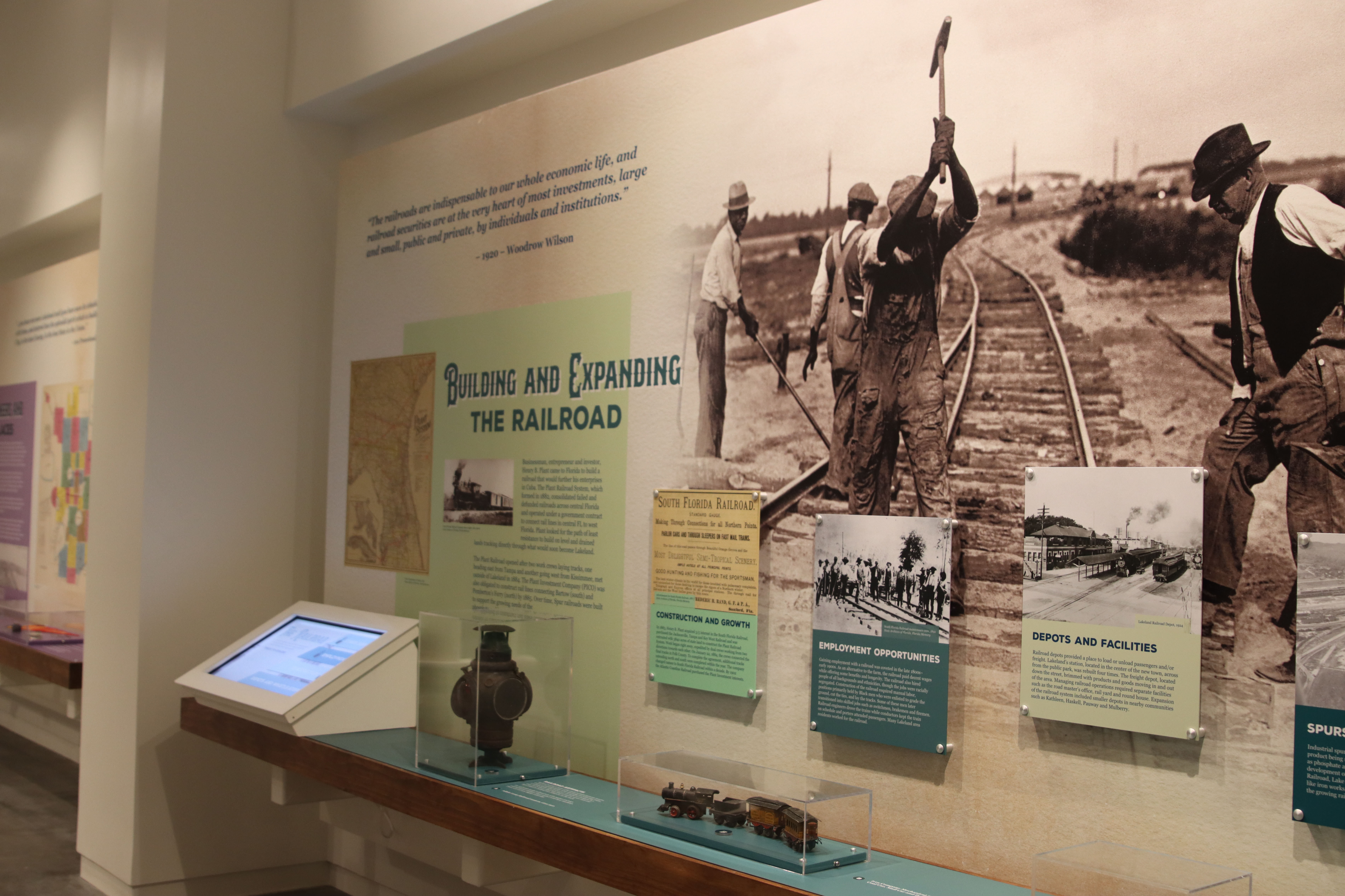 Lakeland History and Culture Center information panel "Building and Expanding the Railroad" with railroad workers
