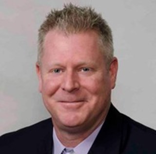 headshot of Brian Rewis