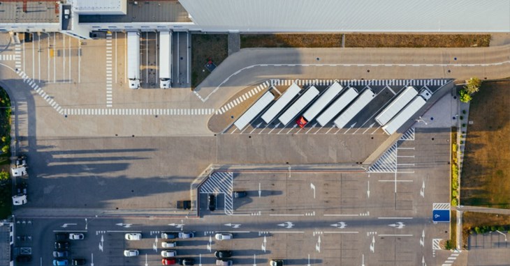 semi trucks unloading at airport