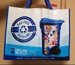 Photo of City of Lakeland free recycling tote - side 1 with recycling container/graphics