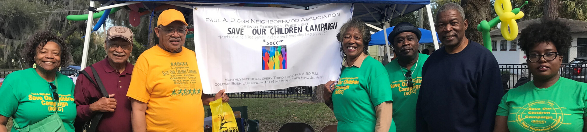 Save our children booth with neighborhood leaders