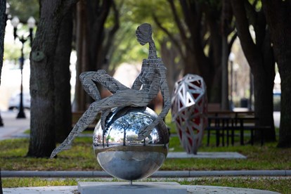 Juan Vazquez Sculpture - woman on sphere (metal)