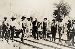 Unidentified laborers laying tracks for the railroad, circa 1884