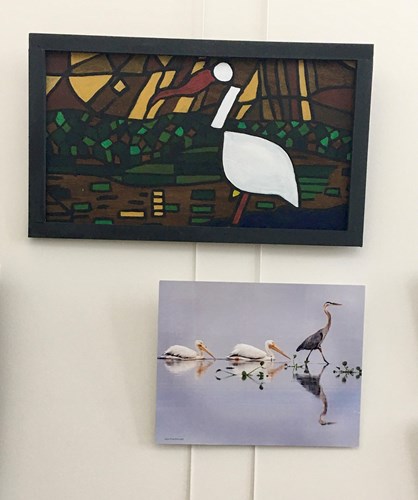 Photos of framed art on the wall at Lake Crago Outdoor Recreation Complex