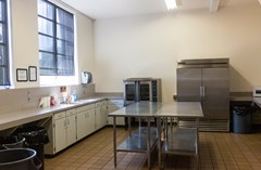 Full catering kitchen including a commercial convection oven and commercial freezer. Not pictured: ice machine and commercial coolers.