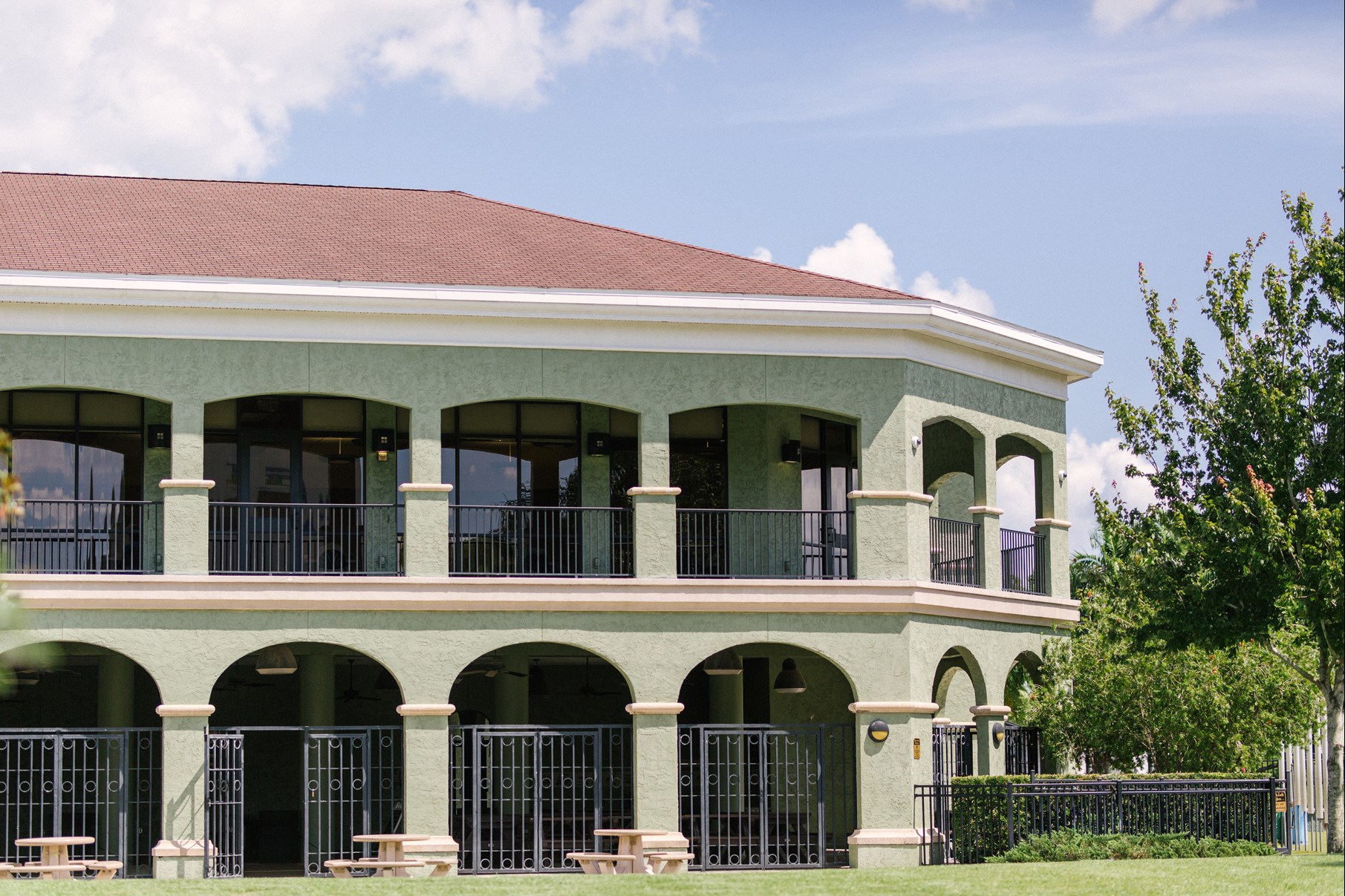 Exterior shot of the Peggy Brown building with view of the upstairs rental space and wrap around lanai