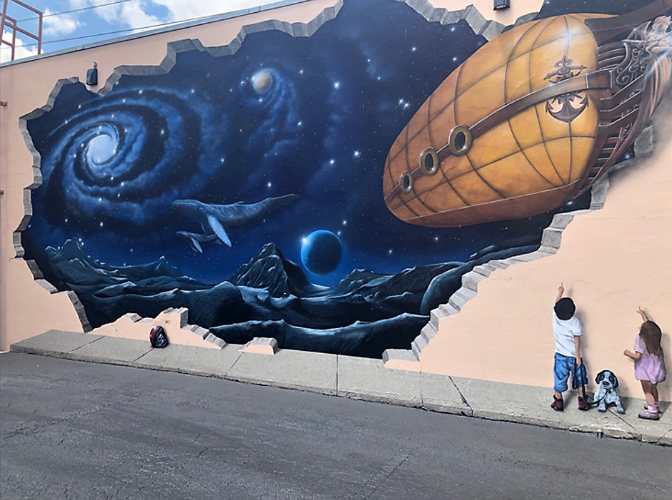 The steampunk "Flights of Fancy" mural by Tim Haas was added to Southside Cleaners as part of the CRA's art infusion program.