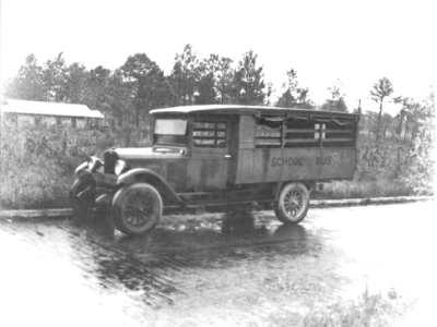 An early Polk County school bus used to transport Polk County students in 1936; link to "Institutes of Learning" Flickr album