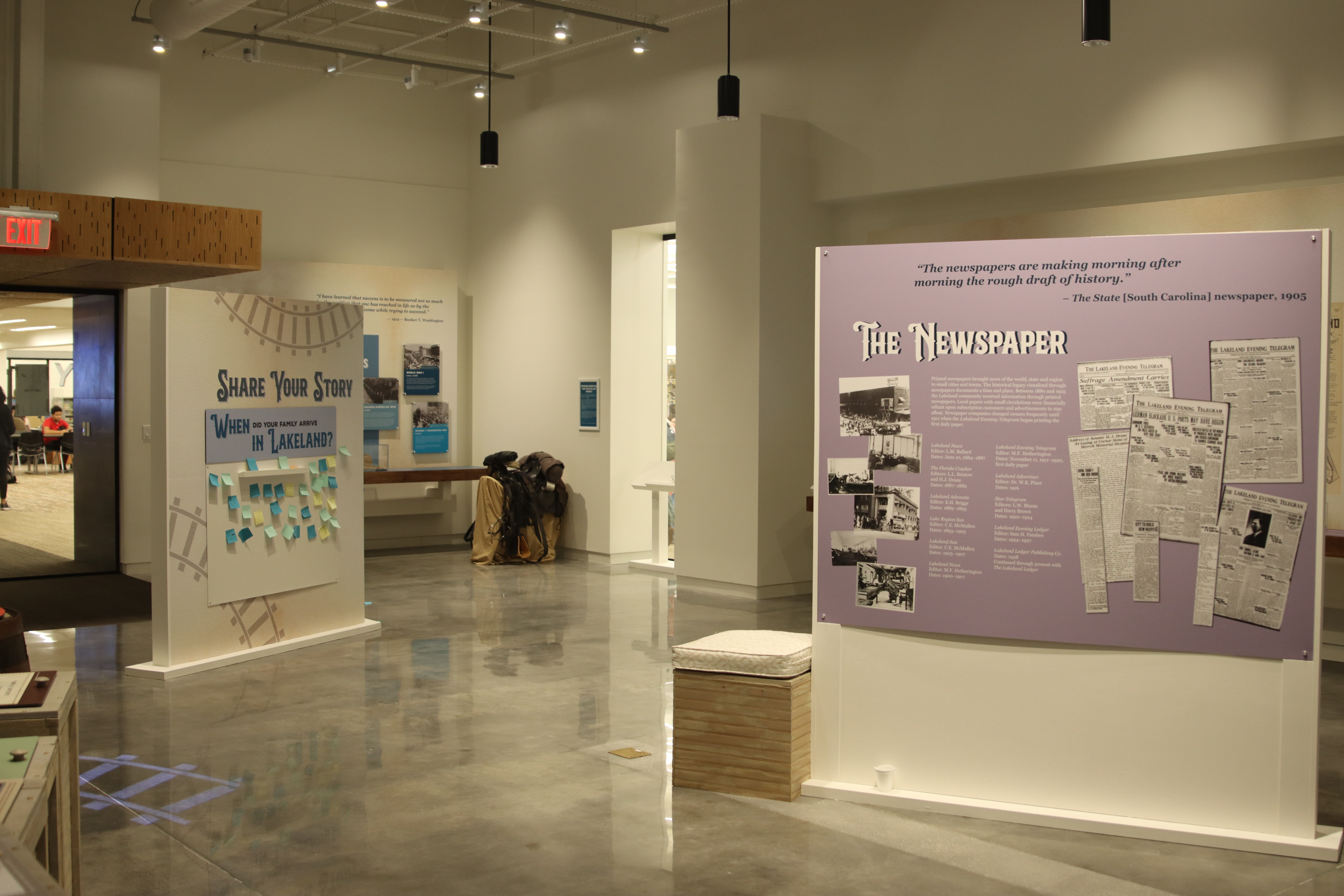 View within the Lakeland History and Culture Center of two information panels, on left "Share Your Story" and on right, "The Newspaper"