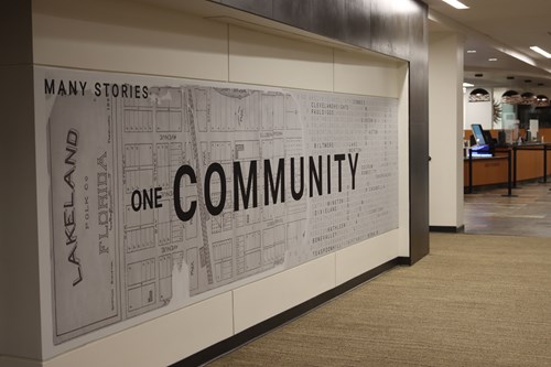 Old map of Lakeland with text "Many Stories One Community"