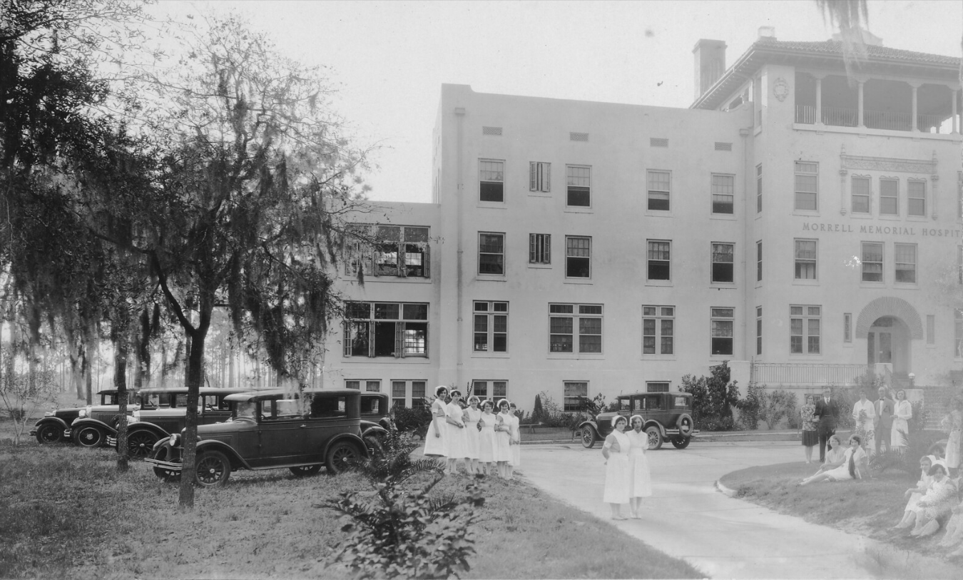Black and white photo of student nurses posing with staff outside newly opened Morrell Memorial Hospital in 1926