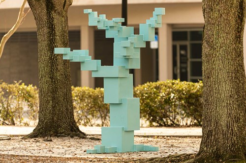 A light blue geometrical tree trunk.