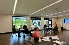 Lake Crago Classroom - set with table and chairs while attendees watch presentation.