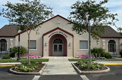 Front Entrance of the Magnolia Building facing the Parking lot and Orange Ave.