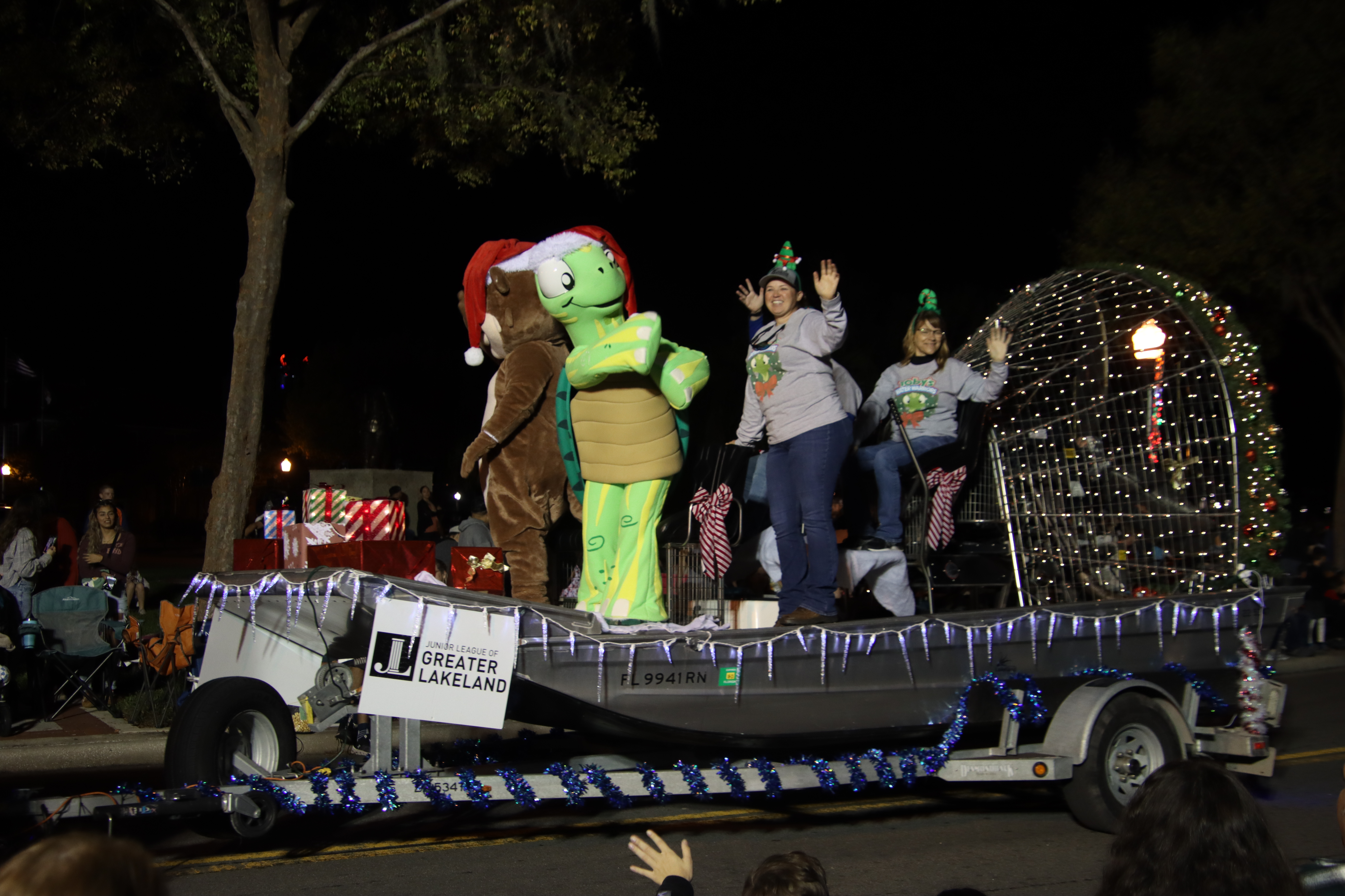 Water Utilities airboat in a parade with Toby the Turtle
