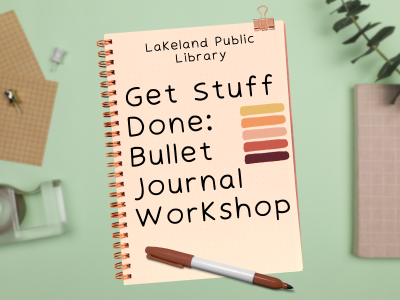 Cream spiral-bound journal with clip and brown sharpie on green desktop with office supplies and text "Lakeland Public Library, Get Stuff Done: Bullet Journal Workshop"; link to library events calendar