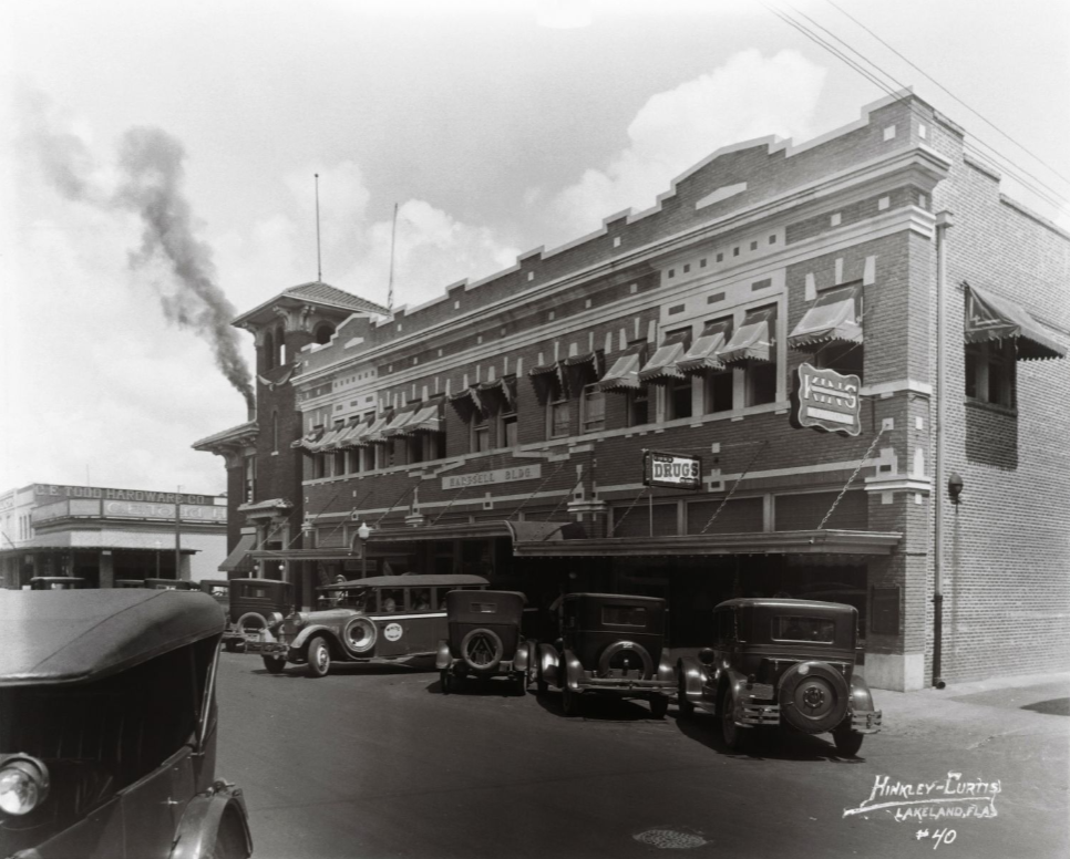 Hartsell Building, located on East Main in Lakeland, was built in the 1920s and owned by Arthur D. Hartsell, Vice President of the Florida Machinery and Supply company as well as the White Bus Line transportation. Angled parking was available for cars in front of the brick two-story building; link to "Hinkley Studios Photography" contentDM collection