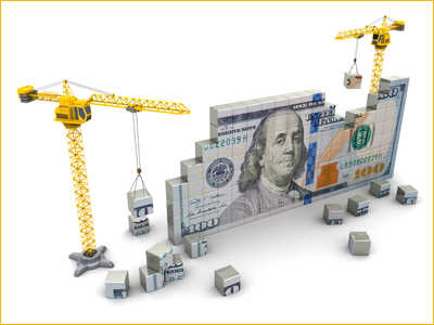 A $100 bill being built out of small building blocks to represent economic development. 