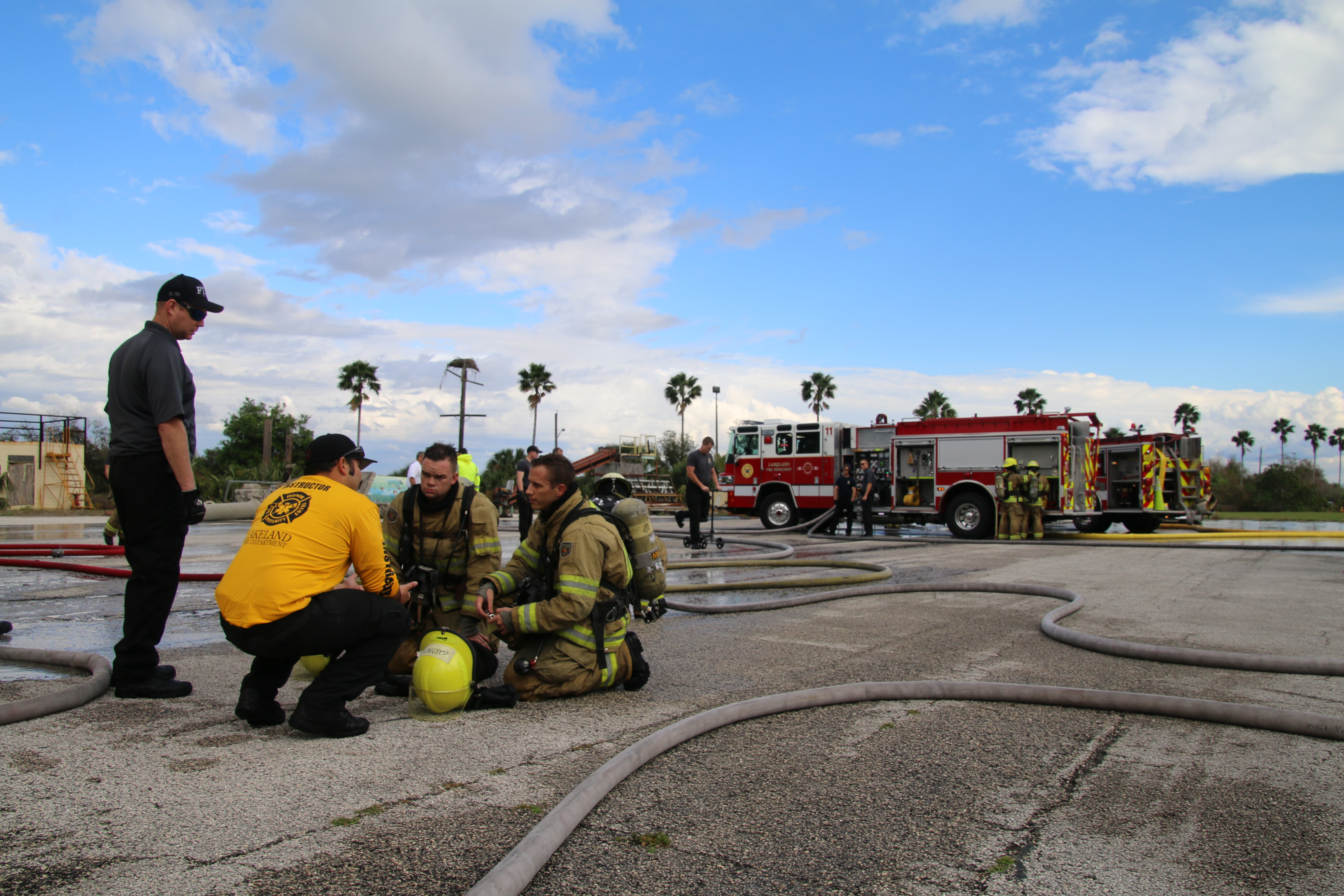 A  picture of new firefighters being instructed at Training Center.