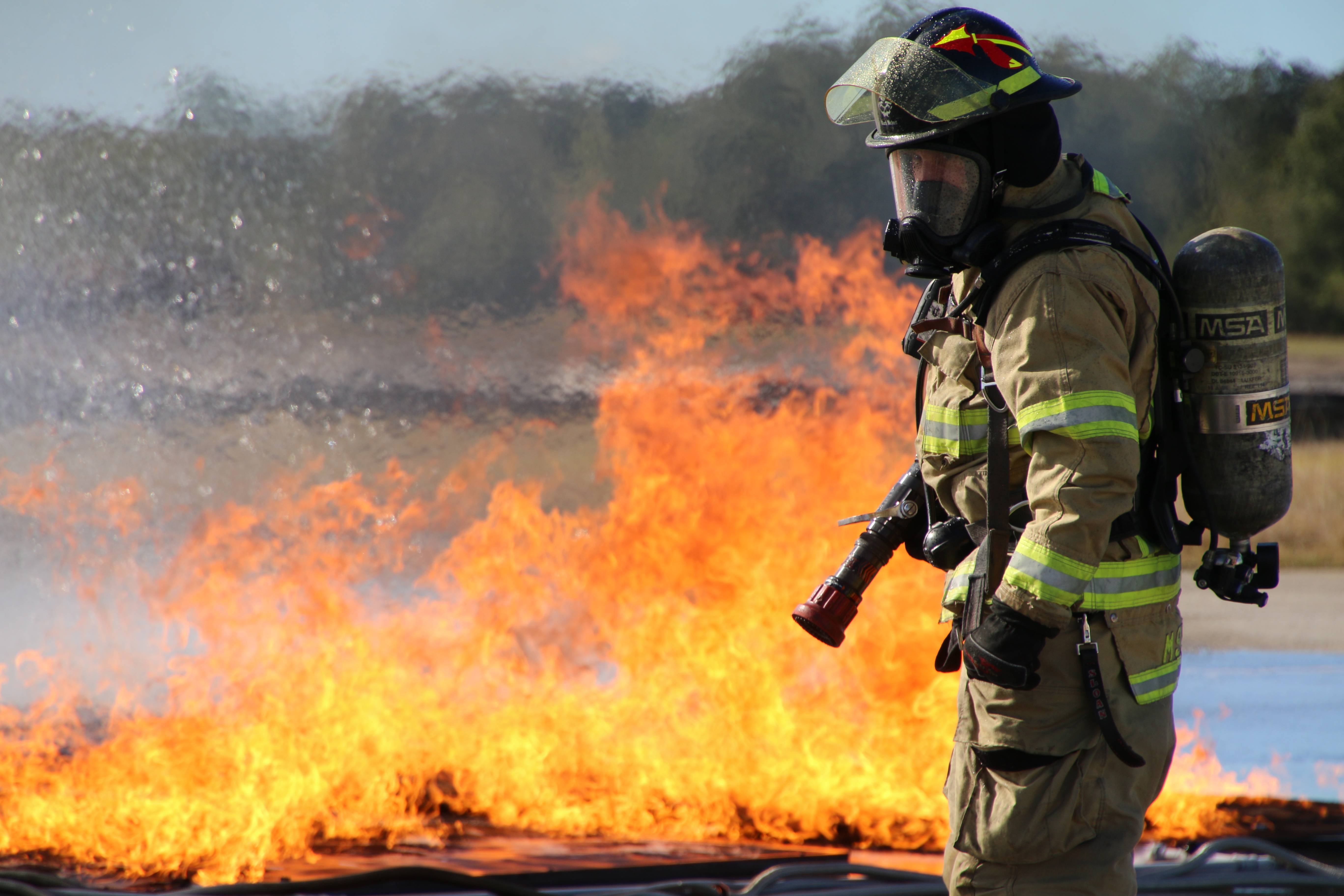 A picture of ARFF firefighter in live fire training