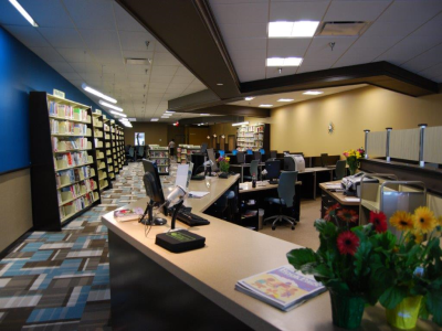 Interior view of eLibrary South Lakeland service desk and bookshelves