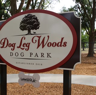 picture of the main entrance sign for Dog Leg Woods Dog Park on Cleveland Heights Blvd.