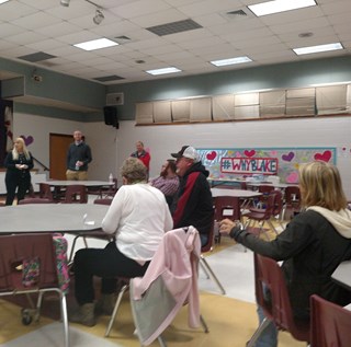 small meeting in school cafeteria